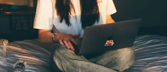 Person conducting reverse image search on a laptop